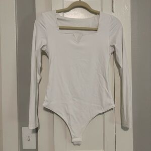 NWOT Women’s White Amazon Stretch Long Sleeve Lowcut One-Piece Thong Bodysuit